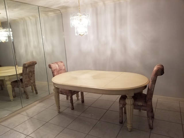 dining area featuring tile patterned floors and a notable chandelier