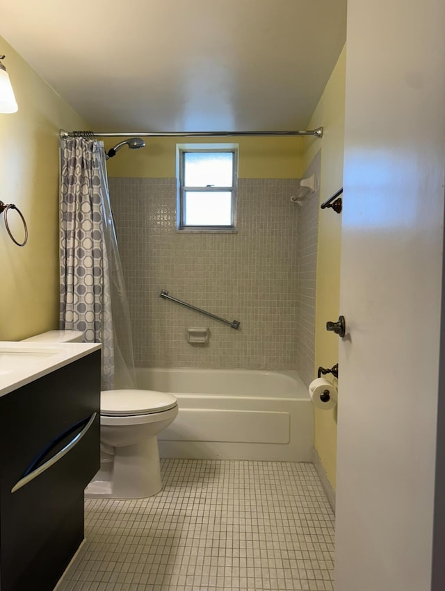 full bathroom featuring shower / bath combo with shower curtain, tile patterned floors, toilet, and vanity