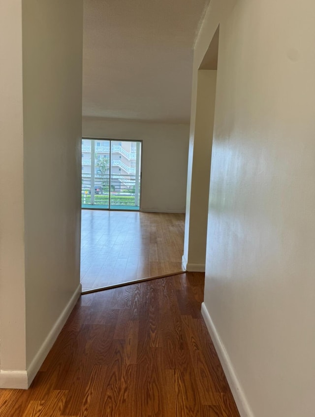 hallway featuring hardwood / wood-style floors