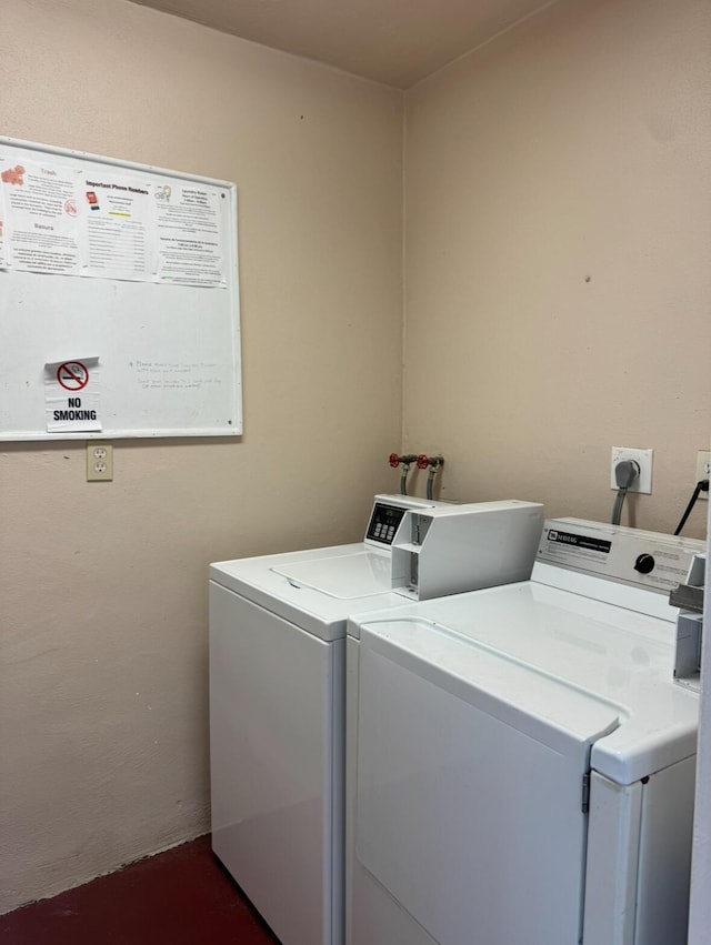 laundry room featuring separate washer and dryer