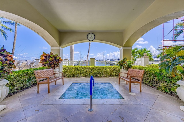 view of pool featuring an in ground hot tub