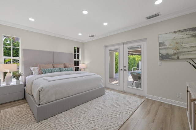 bedroom featuring light wood-type flooring, multiple windows, ornamental molding, and access to exterior