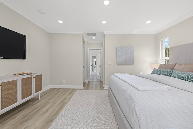 bedroom featuring light wood-type flooring and crown molding