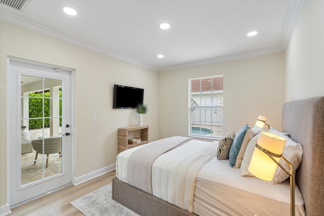 bedroom with crown molding, light hardwood / wood-style flooring, and access to exterior