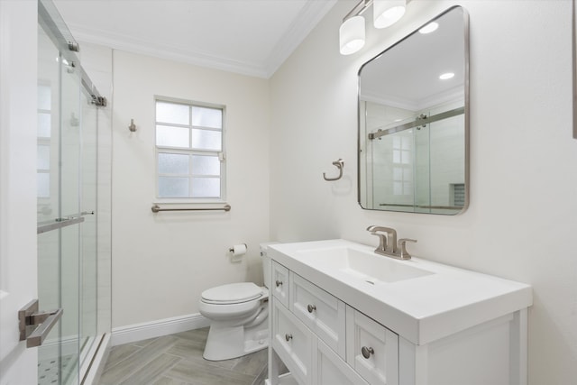 bathroom with crown molding, vanity, toilet, and an enclosed shower