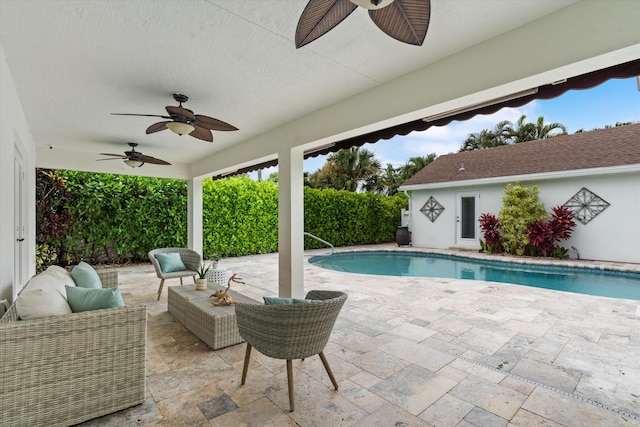 view of swimming pool featuring ceiling fan, a patio area, and an outdoor hangout area