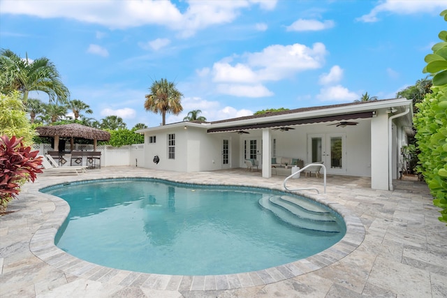 exterior space with french doors, a patio area, and ceiling fan