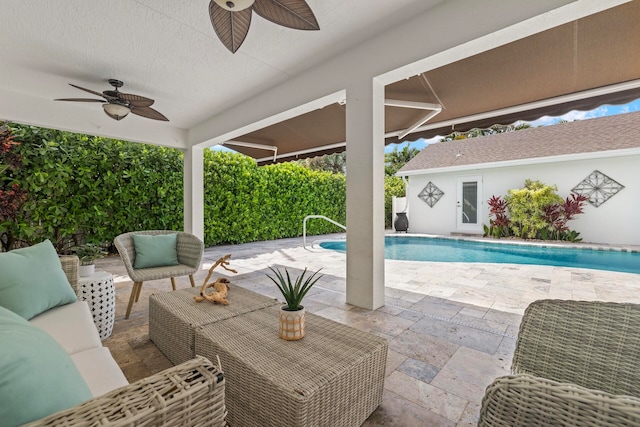 exterior space with a patio, outdoor lounge area, and ceiling fan