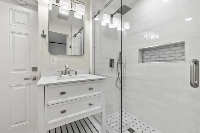 bathroom with vanity and an enclosed shower