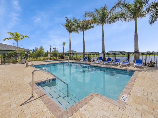 view of swimming pool featuring a patio