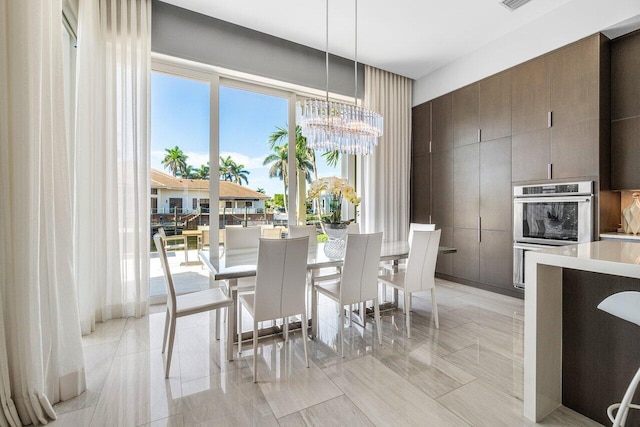 dining space featuring an inviting chandelier