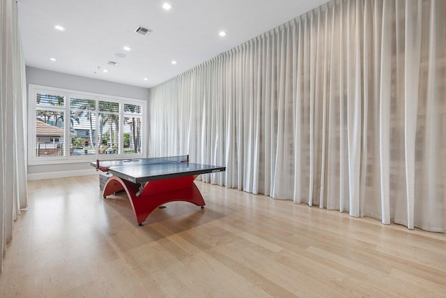 playroom with light hardwood / wood-style floors