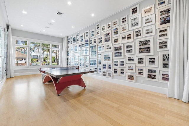 rec room featuring light wood-type flooring