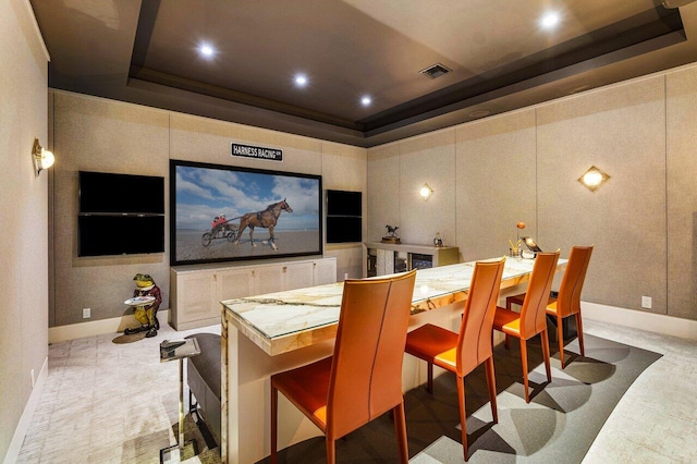 home theater room featuring a tray ceiling