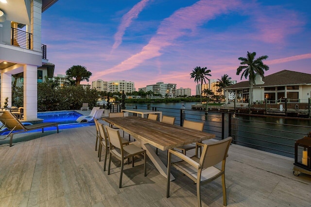 patio terrace at dusk with a water view