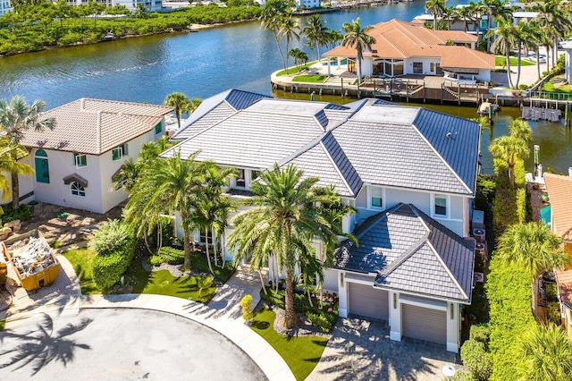 birds eye view of property with a water view