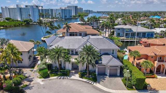 birds eye view of property with a water view