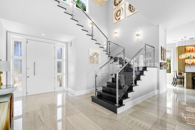 entrance foyer with light tile patterned floors