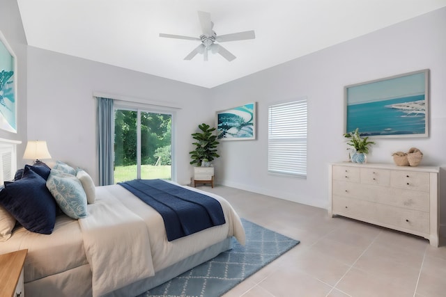 tiled bedroom with ceiling fan and access to outside