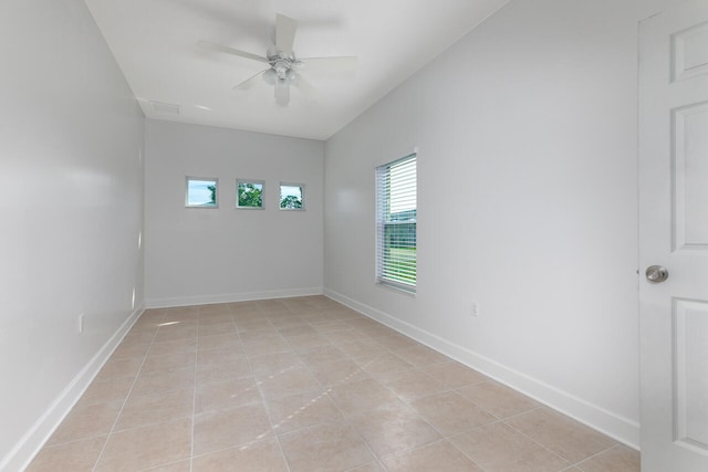 unfurnished room with light tile patterned flooring and ceiling fan