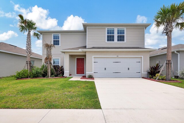 front of property with a front yard and a garage