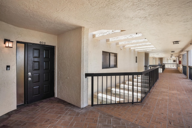 5279 Fountains Dr S Unit 602, Lake Worth, FL 33467 - doorway to property with a balcony and stucco siding