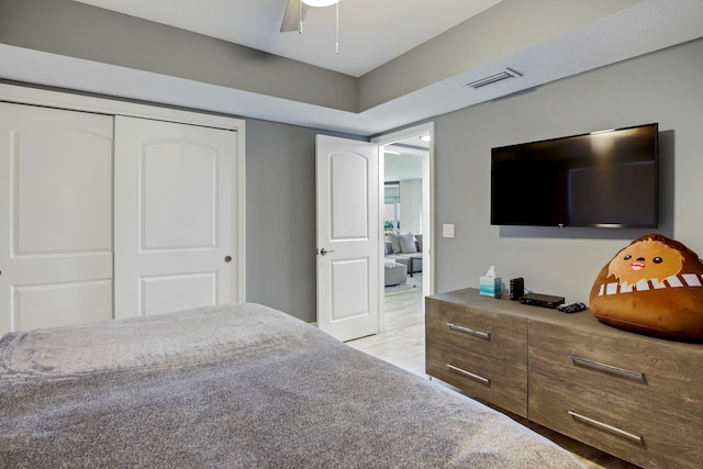 5279 Fountains Dr S Unit 602, Lake Worth, FL 33467 - bedroom featuring a ceiling fan, a closet, visible vents, and light wood-type flooring