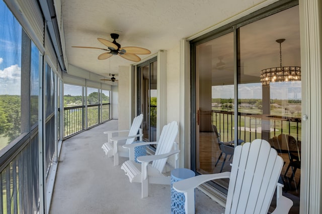 5279 Fountains Dr S Unit 602, Lake Worth, FL 33467 - sunroom / solarium with ceiling fan with notable chandelier