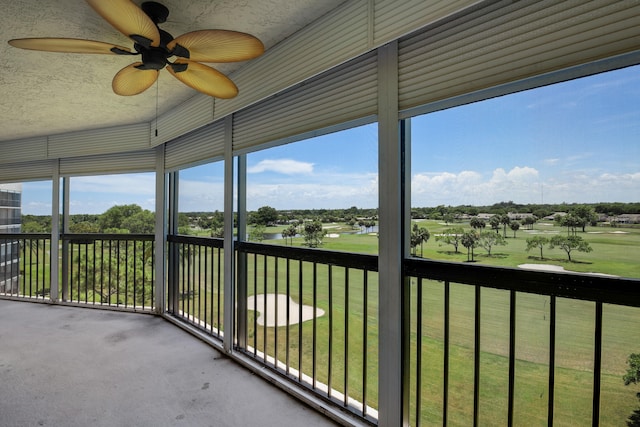 5279 Fountains Dr S Unit 602, Lake Worth, FL 33467 - unfurnished sunroom featuring a ceiling fan, golf course view, and a water view