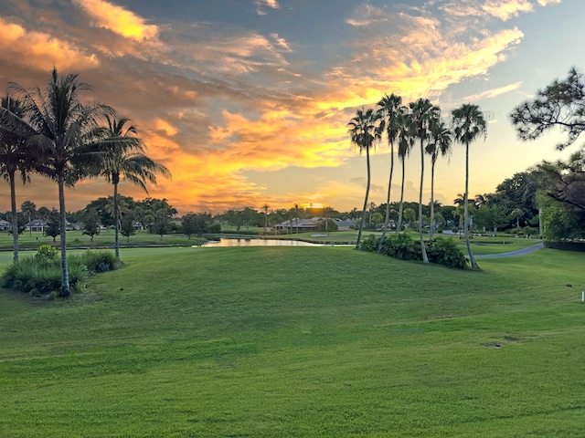 5279 Fountains Dr S Unit 602, Lake Worth, FL 33467 - surrounding community featuring a lawn and a water view