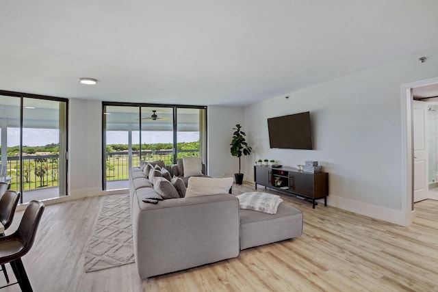 5279 Fountains Dr S Unit 602, Lake Worth, FL 33467 - living area featuring baseboards, a ceiling fan, wood finished floors, and floor to ceiling windows