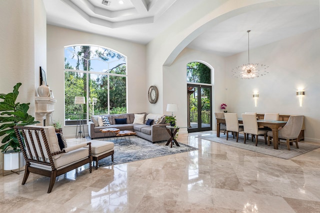 living room featuring a towering ceiling