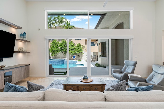 living room with a high ceiling