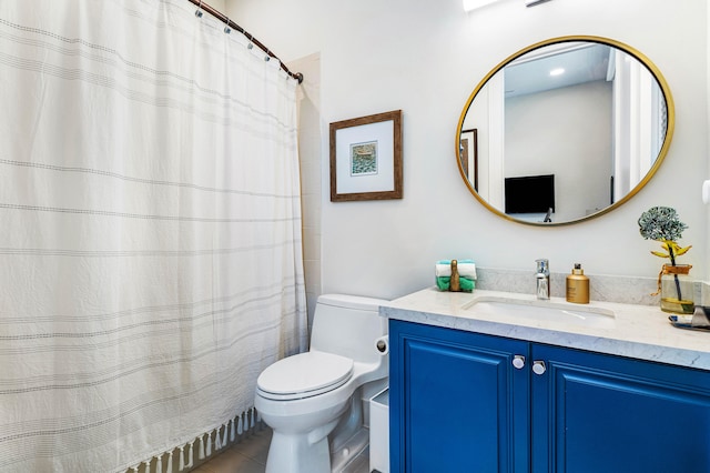 bathroom with vanity, toilet, a shower with curtain, and tile patterned flooring