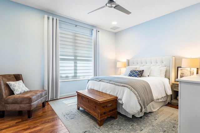 bedroom featuring dark hardwood / wood-style flooring and ceiling fan