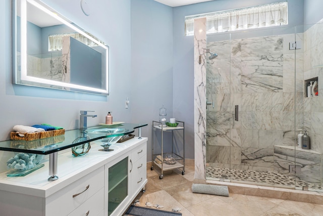 bathroom with vanity, walk in shower, and tile patterned flooring