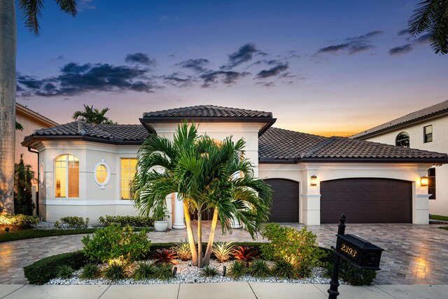 mediterranean / spanish-style home featuring a garage