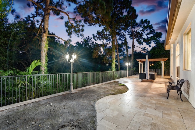 view of patio terrace at dusk