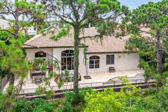 rear view of house with a patio