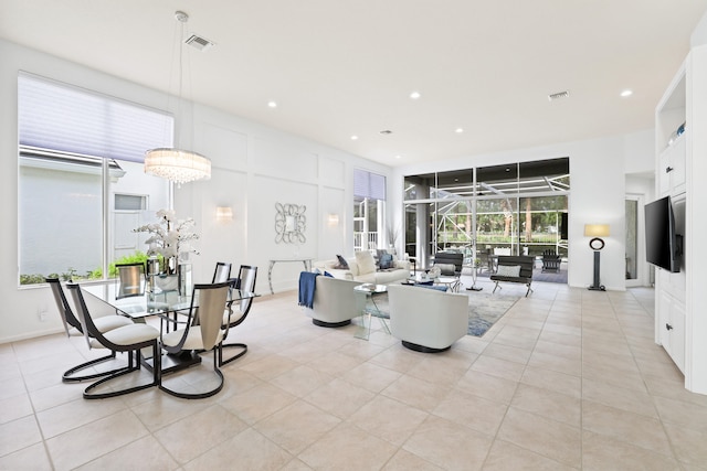 interior space featuring light tile patterned flooring and a notable chandelier