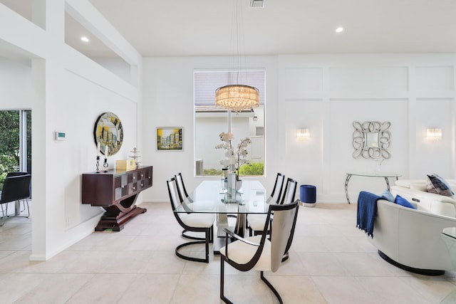 tiled dining area with a notable chandelier