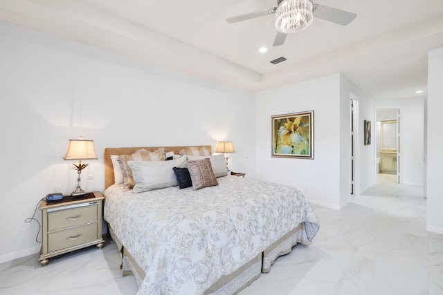 bedroom with ensuite bath and ceiling fan