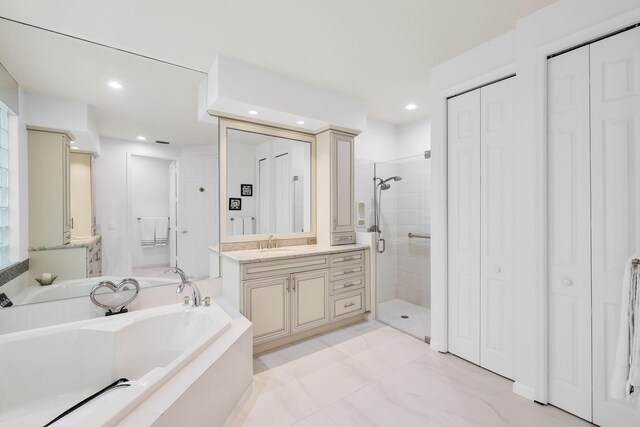 bathroom with vanity and plus walk in shower