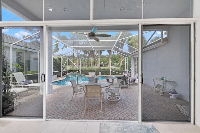 exterior space with ceiling fan and vaulted ceiling