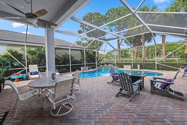 view of pool featuring a lanai, ceiling fan, and a patio