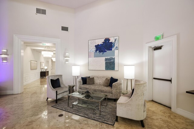 living room with a towering ceiling