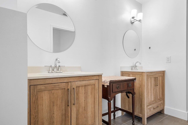 bathroom with tile patterned flooring and vanity