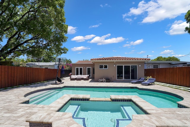 back of property featuring an outdoor living space, a fenced in pool, and a patio