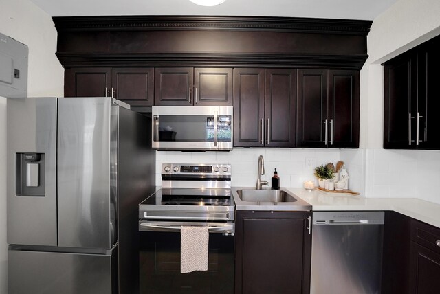 1305 NE 1st Ave, Fort Lauderdale, FL 33304 - kitchen featuring appliances with stainless steel finishes, a sink, backsplash, light tile patterned flooring, and french doors