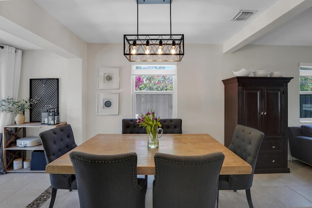 tiled dining room with plenty of natural light